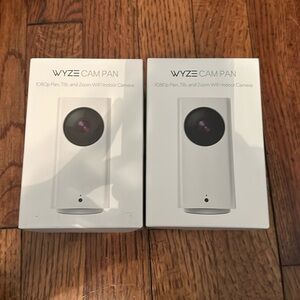 Two brand new Wyze cameras.